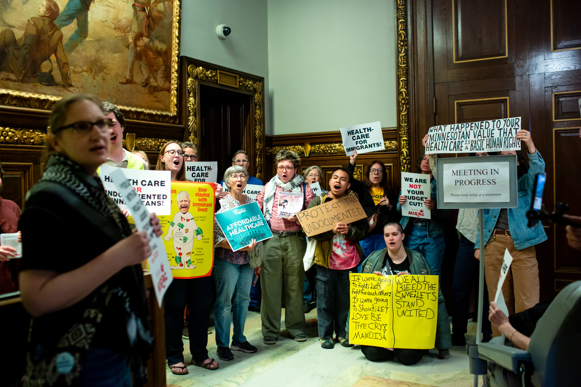 Immigrant rights activists protest plan to end low-cost health insurance for undocumented adults